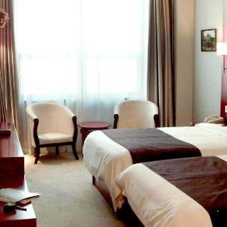 Starway Tianjin Rome Business Hotel Quarto foto
